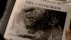 A picture of a Hellhound in a book.