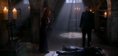 Rowena standing over Guthrie's corpse with Crowley (The Hunter Games)