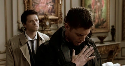 Dean fails to get the desired effect from punching Castiel in the face.