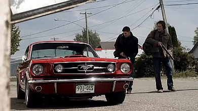 The boys take note of a sweet ride on the way into town.