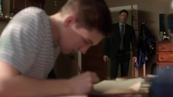 Dean finds Shawn drawing pictures of figures in plague masks