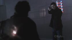 Dean kills a werewolf with a silver bullet.