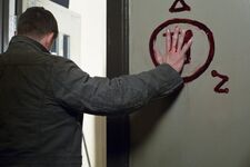 An angel banishing sigil drawn in human blood.