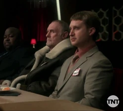 First unnamed god seen next to Odin.