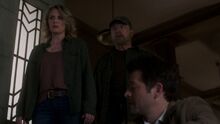 Mary and Bobby return to the main area where they finds Castiel sitting down