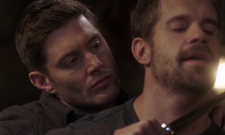 Dean putting a knife to Pax's throat