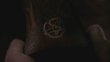 The Pentagram on the handle of the gun