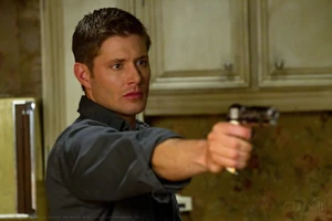 Dean with his gun at the ready