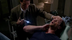 Castiel stops the grace extraction process and sympathizes with Sam