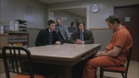 Rick is questioned by Sam, Dean, and Bobby.