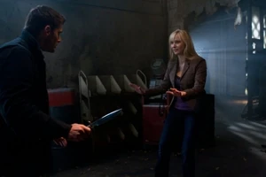 Dean pointing a knife at Marlene