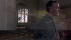 The vengeful spirit of Isabella possessing Father Delaney in the church