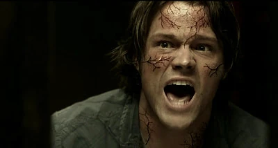Sam screams for Dean and Bobby to help him.