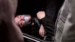 Dean takes Sam over to the Impala and shows him Crowley, bound and gagged in the trunk