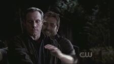 The spirit of John grabs Azazel from behind.