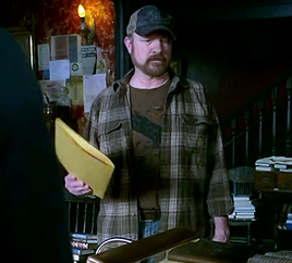 Bobby holding the duplicate of Moishe's journal