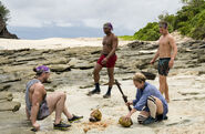 Jeremy with his tribemates on the beach.