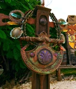 Heroes vs. Healers vs. Hustlers A colorful metal necklace with several medallions around it.