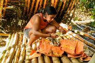 Kamilla working on unlocking Kyle's Hidden Immunity Idol.