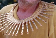 Thailand A golden necklace with jewels and points.