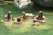 Members of Enil Edam in the water.