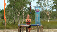 Abi-Maria balances her statue in Cambodia.