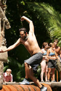 Coby crosses the rolling log (Palau).