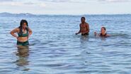 Wendy and Reem teaching Keith how to swim.