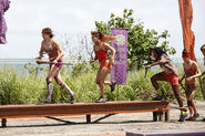 Vanua crossing the balance beam.