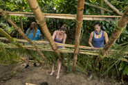 Natalia, Natalie, and Alison working on the tribe shelter.