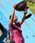 Aileen holding the Immunity Idol.