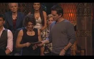 Denise receives her check for the million dollars at the Reunion Show.