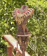 Cambodia A large red and gold necklace with golden designs, attachments and artifacts.