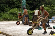 The Merged Tribe competes in the Individual Immunity Challenge, Driving Wheel.