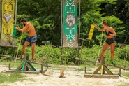 The Merged Tribe competing in the Reward/Immunity Challenge, Scale Challenge / Teeter Tower.