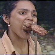 Sandra eating steak.