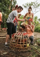 Adam holding the chickens.