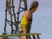 Scout competes in the first challenge of the merge.