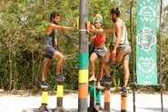 The Merged Tribe competing in the Reward Challenge, Hands on a Hard Idol.