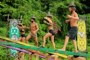 The Merged Tribe competing in the Final Immunity Challenge, Price On Your Head / Snake in the Grass / Domino Effect.