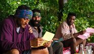Joe, Shauhin, and Kyle reading their letters from home.