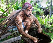 Feras searching for a Hidden Immunity Idol.
