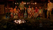Reynold gives Malcolm the Hidden Immunity Idol.