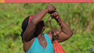 Cirie untying a bag for Mana in Dulcimer Stomp.