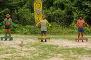 The Merged Tribe competing in the Reward/Immunity Challenge, Bow Diddley.