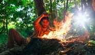 Sam practising fire-making.