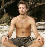 Aras practicing his yoga at camp.