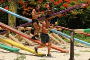 The Merged Tribe competing in the Reward/Immunity Challenge, Unchained Medley.