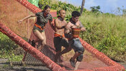 Debbie, Tai, and Caleb racing down the teeter-totter.