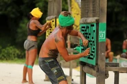 The Merged Tribe competing in the Reward/Immunity Challenge, Rusty Gates.